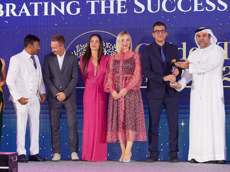 Award winner receiving global recognition and trophy